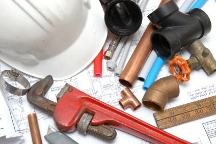 Plumbing parts, tools, and plans used by Liberty Plumbing and Drain.